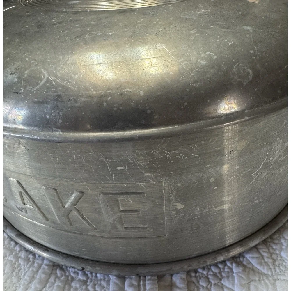 vintage 1950s‎ aluminum cake topper that says in embossed letters 